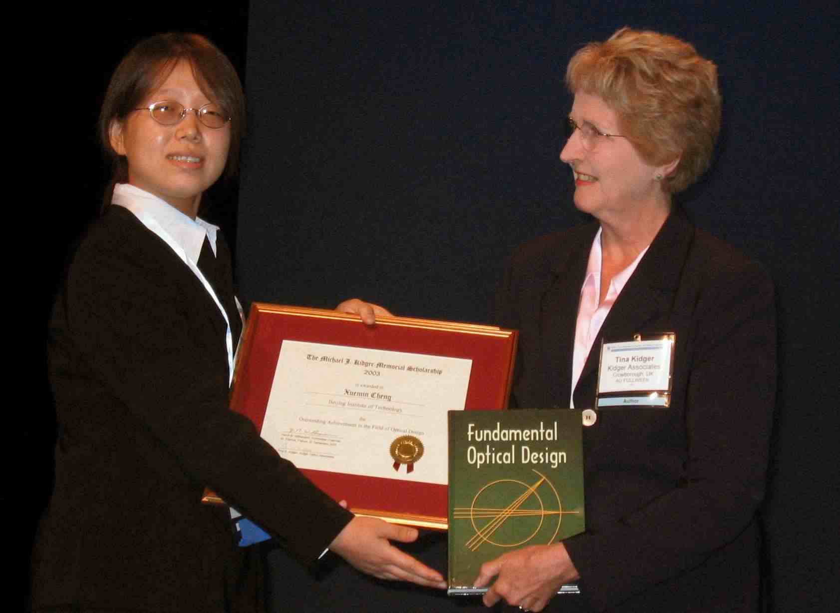 2003 Xuemin Cheng accepts award from Tina Kidger 2003 Xuemin Cheng accepts award from Tina Kidger