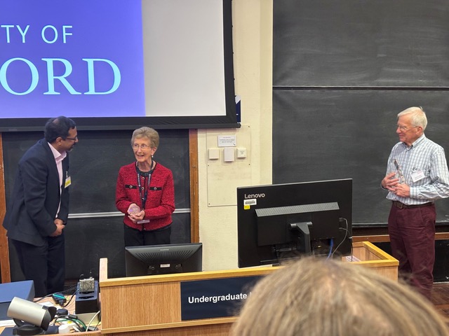 Tina with her award, Niranjan and David